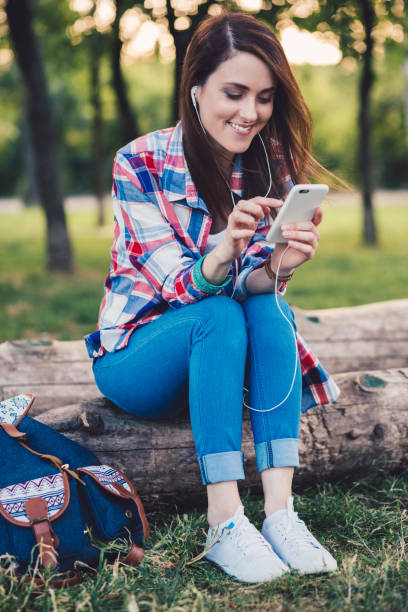 istock Woman among nature talking on video call 1302257654