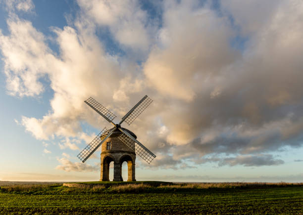 Chersterton Windmill below clouds Chesterton Windmill is a 17th-century stone tower windmill located outside the village of Chesterton, Warwickshire. It is a Grade I listed building and a striking landmark in south-east Warwickshire. chesterton photos stock pictures, royalty-free photos & images