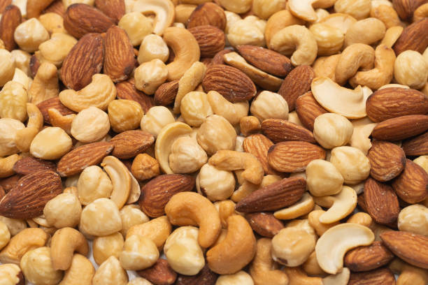 istock Mix of nuts isolated on white background. Top view. 1302260688