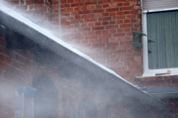 istock Snowstorm gutter full of snow 1302261216