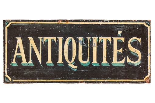 Old advertisement sign with the French text 