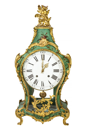 Authentic eighteenth century green table clock isolated on a white background