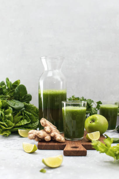 istock Green detox smoothies with fresh leafy vegetables and ginger 1302262358