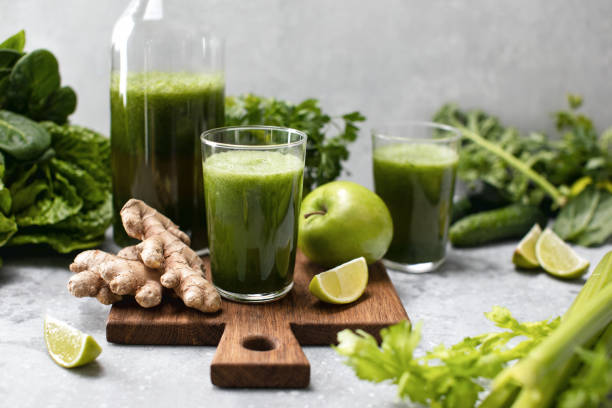 istock Green detox smoothies with fresh leafy vegetables and ginger 1302262894