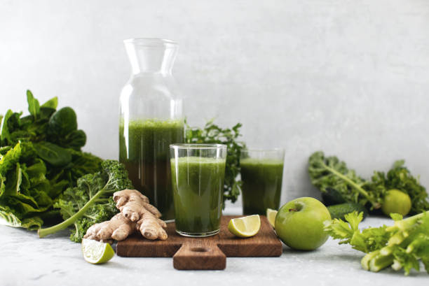 istock Green detox smoothies with fresh leafy vegetables and ginger 1302262897