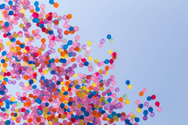 istock many colorful balloon flying in blue sky 1302265022