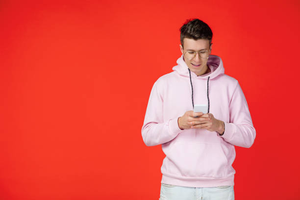 istock Caucasian man's portrait isolated on red studio background with copyspace 1302270476
