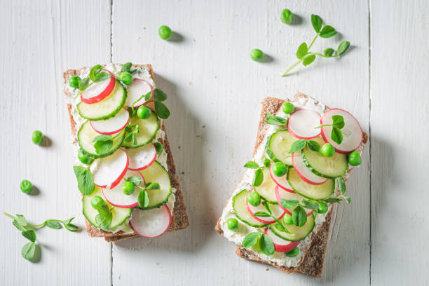 istock Fresh sandwich with creamy cheese, peas and radish 1302270507
