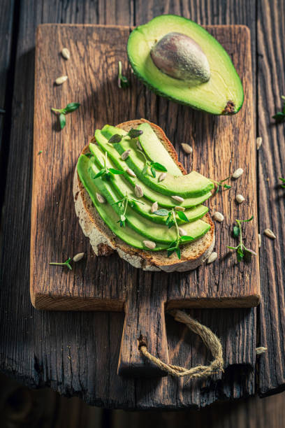 istock Fresh sandwich with avocado, sunflower seeds and herbs 1302271593