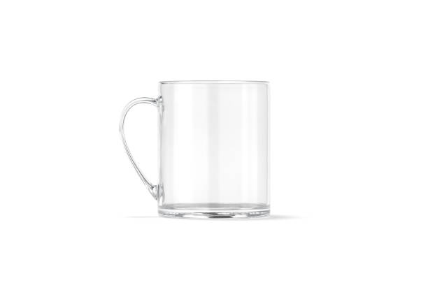 istock Blank transparent glass 11 oz mug with handle mockup stand, isolated 1302273363