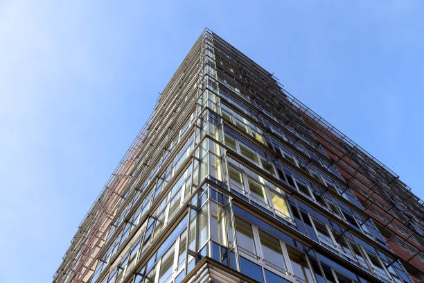istock Modern office building facades with glass and reflecting sunlight in the windows 1302274089