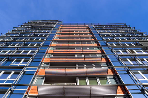 istock Modern office building facades with glass and reflecting sunlight in the windows 1302274241