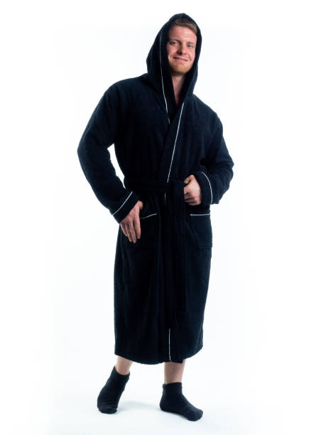istock strong man in a Bathrobe on an isolated white background with a smile on his face. 1302275931