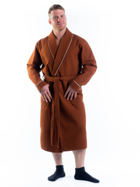 istock strong man in a Bathrobe on an isolated white background with a smile on his face. 1302275942