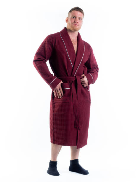 istock strong man in a Bathrobe on an isolated white background with a smile on his face. 1302275945