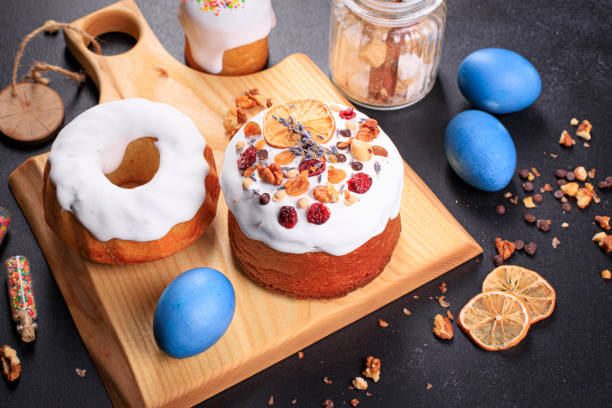 istock Easter cake and Easter eggs festive table setting traditional decor and treats on the table. Happy easter holiday meal snack outdoor top view copy space  food background rustic 1302277743