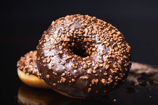 istock Sweet donuts with chocolate sprinkles 1302278867