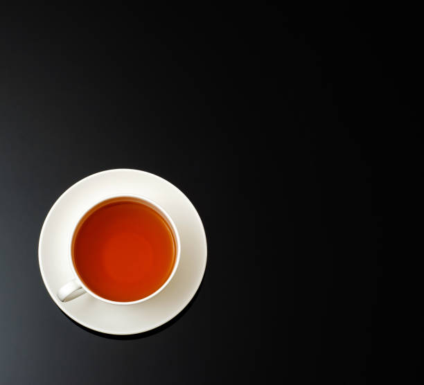 Cup of tea on black background