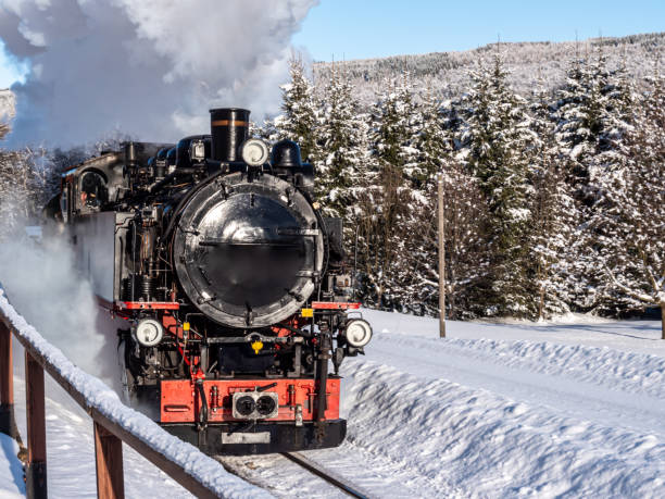 historic steam locomotive in the wintry Ore Mountains historic steam locomotive in the wintry Ore Mountains erzgebirge stock pictures, royalty-free photos & images
