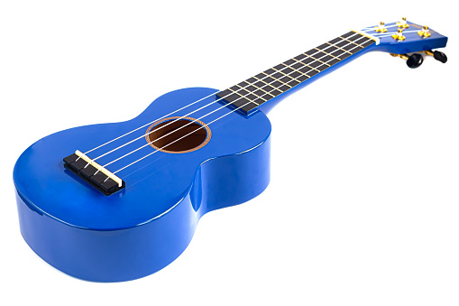 Guitar musical instrument in blue on a white background. Ukulele. Isolate. Copy space.