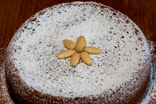A typical italian cake torta caprese made of chocolate and almonds