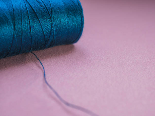 istock Close up Sewing spool with pink background. Dressmaker concept. 1302283007