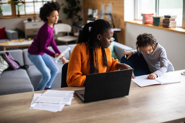 istock Mother working from home with young children in coronavirus isolation 1302283030