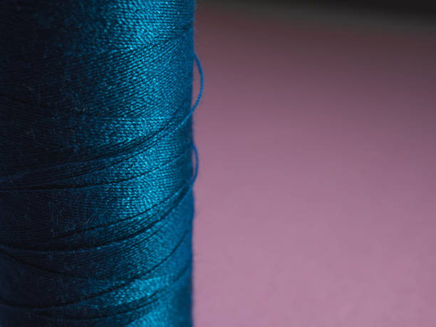 istock Close up Sewing spool with pink background. Dressmaker concept. 1302283049