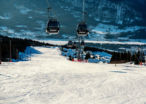 Hafjell, Norway - Feb. 6th 2021: Hafjell ski resort with downhill slopes, ski lifts and cabins.