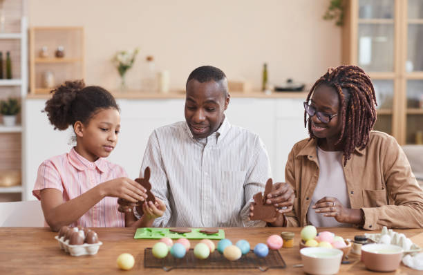 istock African American Family Making Easter Decorations 1302285745
