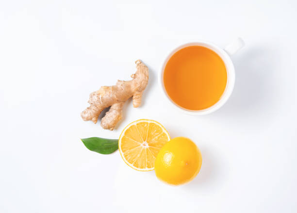 istock Creative layout of fresh tea with lemon and ginger on a white background. 1302285986