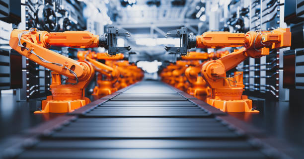 Robotic arms along assembly line in modern factory. Robotic arms along assembly line in modern factory. Heavy industry, technology and machine learning. 3D rendering production line stock pictures, royalty-free photos & images