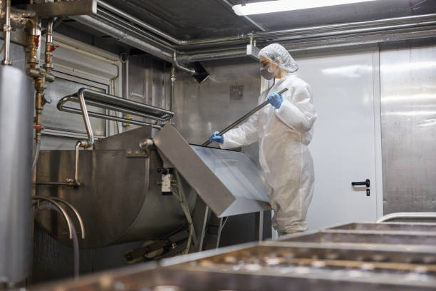 istock Woman Working at Dairy Factory 1302286515