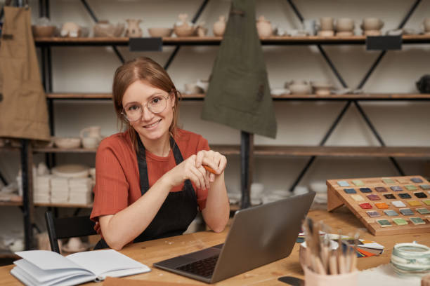 istock Smiling Young Woman Managing Small Business 1302287627
