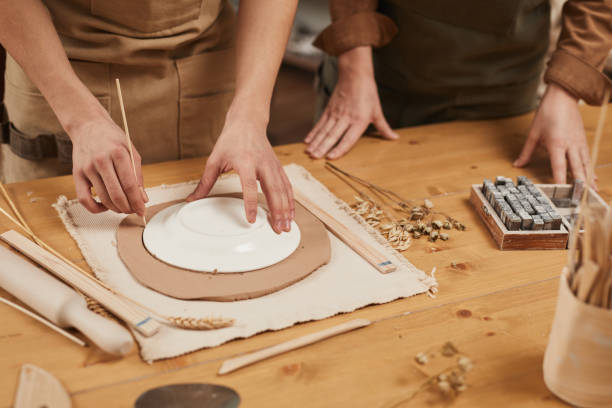 istock Female Potter Making Ceramics Close Up 1302287668