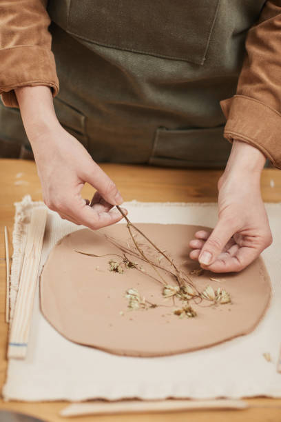 istock Female Hands Making Decorated Ceramics Close Up 1302287671