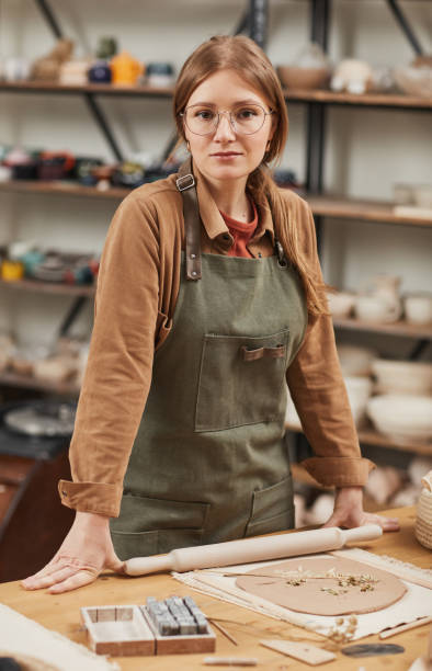 istock Young Woman Making Decorated Ceramics 1302287677