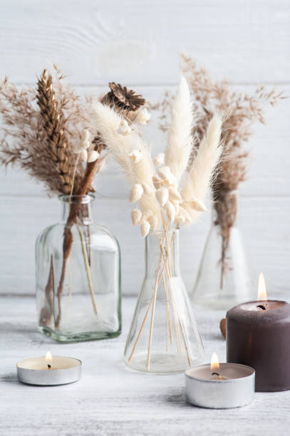 istock Lit aroma candle and dry flowers 1302290870