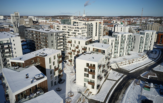 White apartment blocks in aerial view. Odense town Harbor area in Denmark. Winter cold and snow