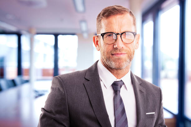 istock Executive financial businessman standing at the office 1302292649