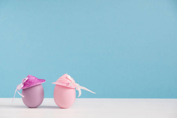 istock Positive girlfriends. Happy eggs in hats. Easter holiday concept with cute funny eggs. Different emotions and feelings 1302298029
