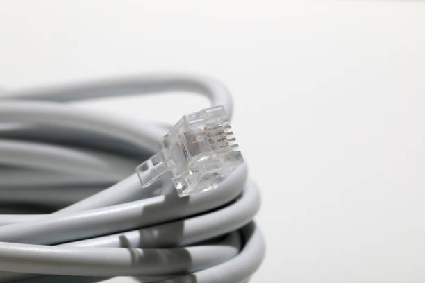 câble téléphonique avec prise, rj11 - cable telephone line phone cord network connection plug photos et images de collection
