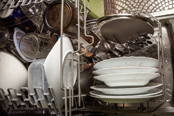 istock Dishwasher with dirty dishes 1302298402