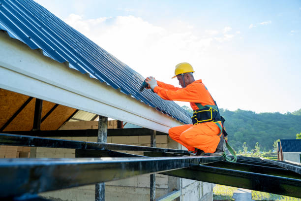 istock Roofer worker using air or pneumatic nail gun and installing asphalt shingle on top of the new roof. 1302299476