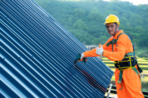 istock Roofer worker in special protective work wear use electric drill installing new roofs. 1302299548