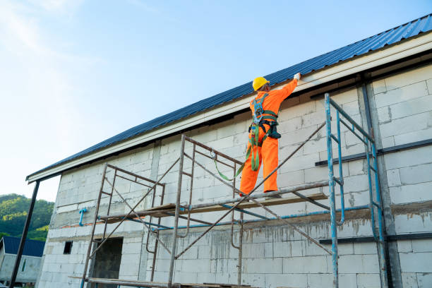 istock Working at height equipment,Construction worker wearing safety harness belt during working on roof structure of building. 1302299550