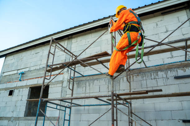 istock Construction worker wearing safety harness belt during working at high place. 1302299576