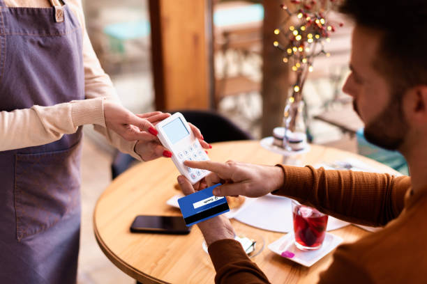 istock Paying with credit card in the cafe 1302300509
