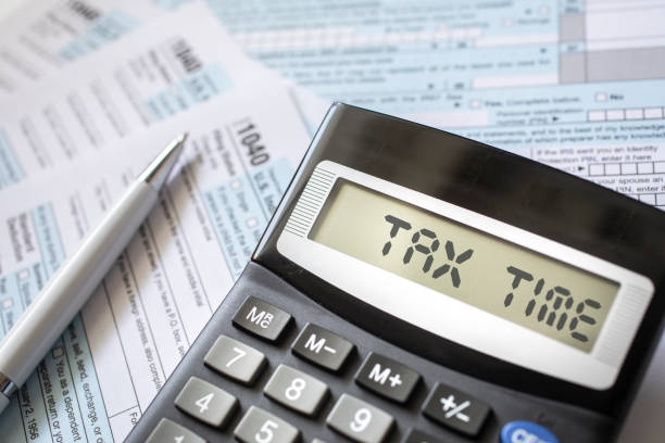 istock Close up of a Tax return form with a calculator 1302300669