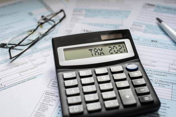 istock Close up of a Tax return form with a calculator 1302300670